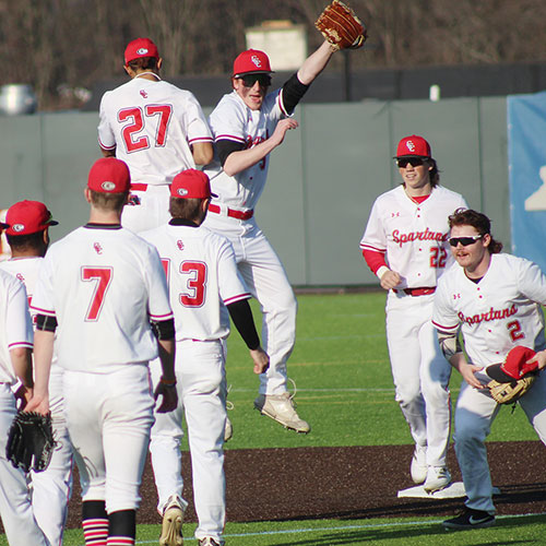 Baseball team celebration on the pitchers mound after a big win