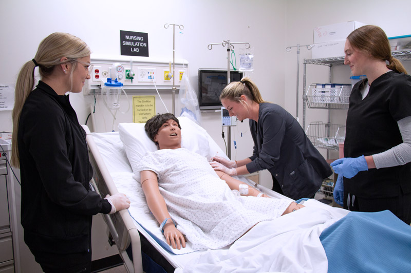 Cayuga nursing students working in the nursing lab