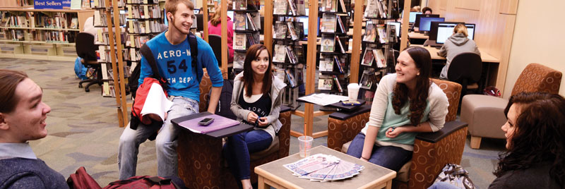 Students gathered talking in the Fulton library
