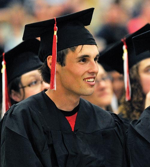 A Cayuga student at his graduation ceremony