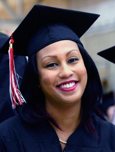 Image of graduating student smiling