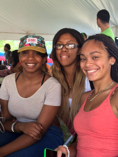 Image of three students at student orientation