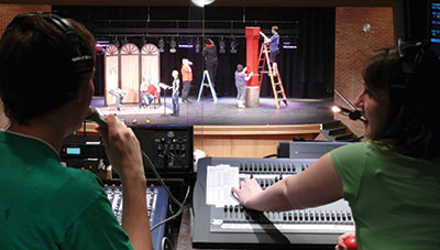 Behind the scenes in the control booth in the Bisgrove Theater