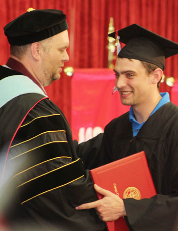 President Durant Congratulating a Nursing Student on stage